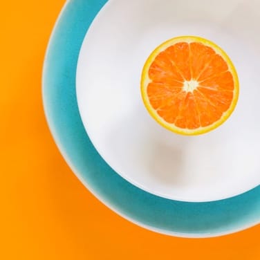 Orange on a plate.