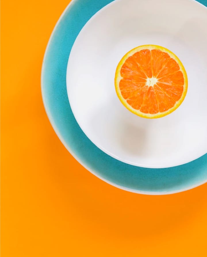 Orange on a plate.